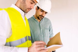 Building contractors determining a building emergency response plan
