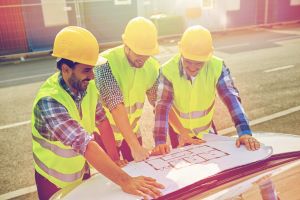 Contractors reviewing building plans.